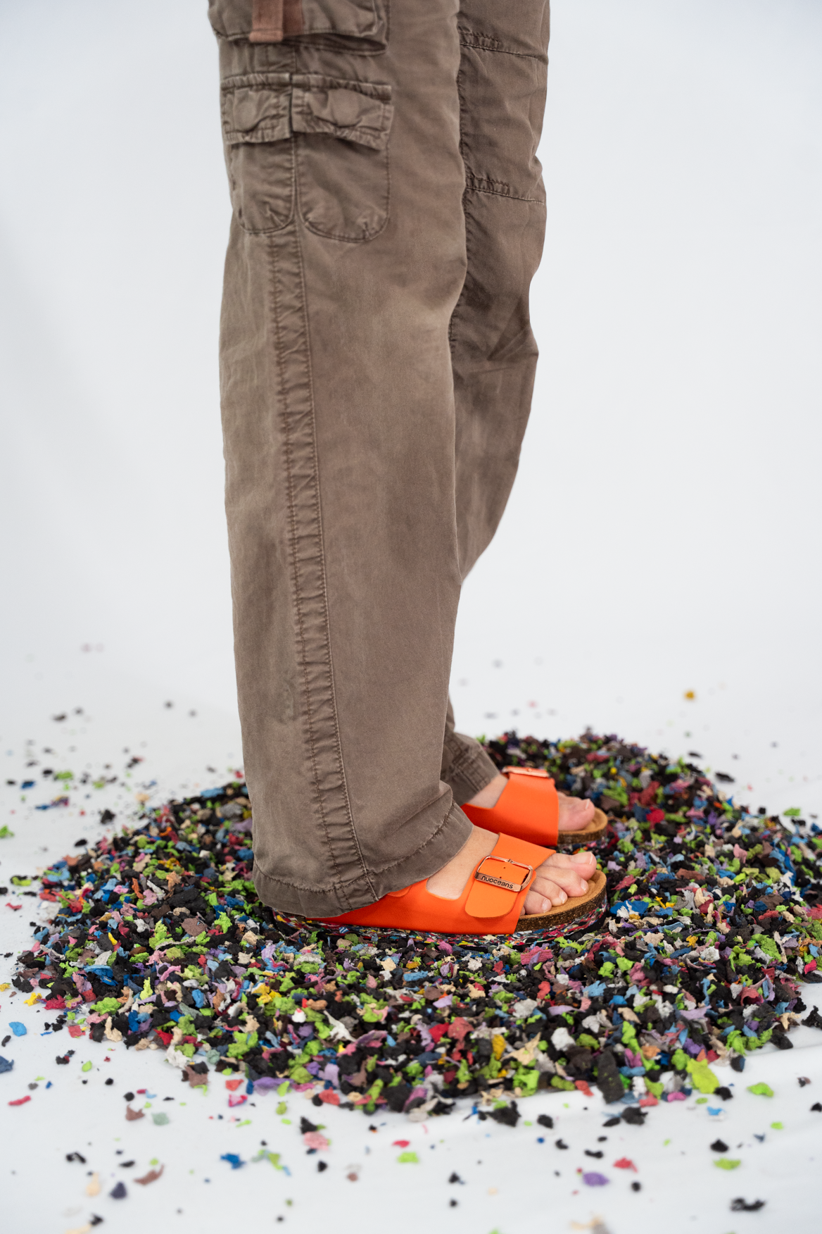 Nuoceans TROPIC orange vegan leather sandal worn lifestyle image