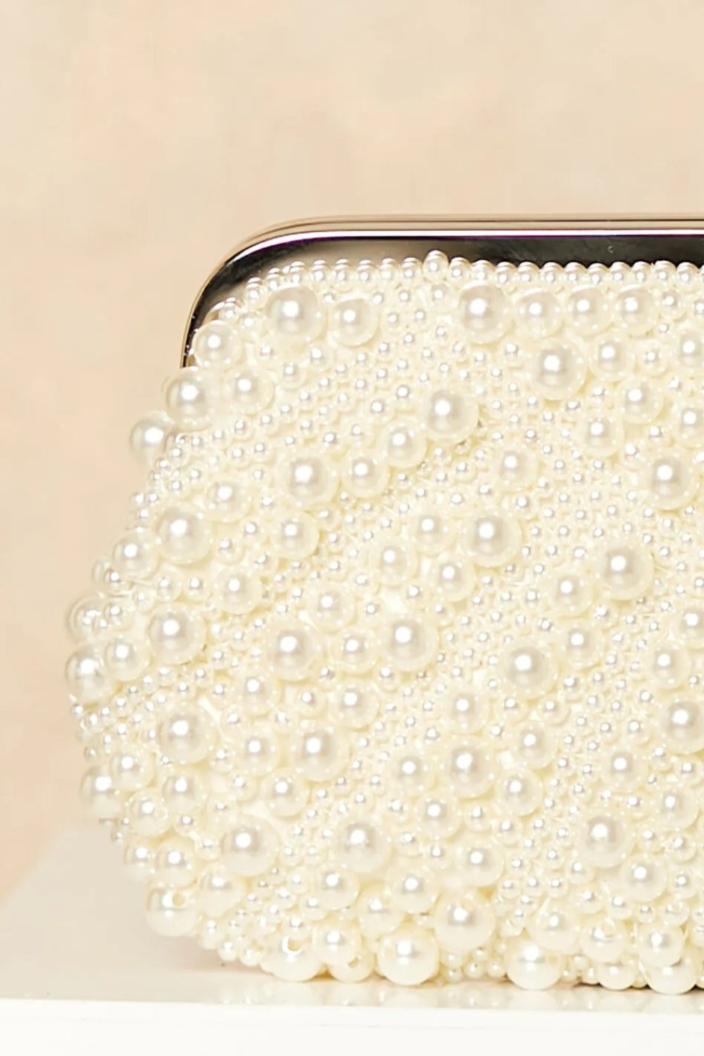 Aftershock London ivory pearl and crystal clutch bag close-up detail