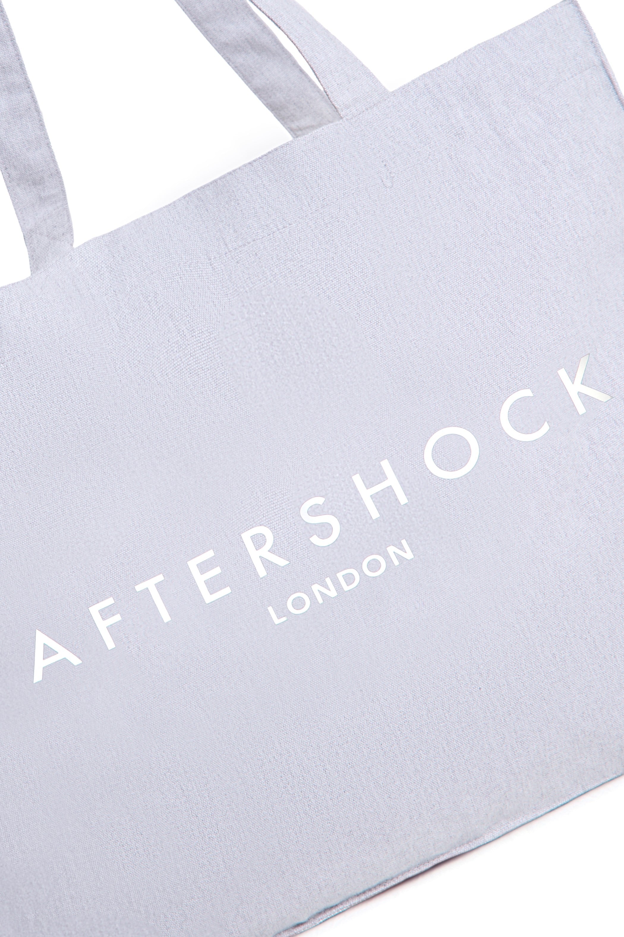 Aftershock London silver grey logo canvas tote bag side view