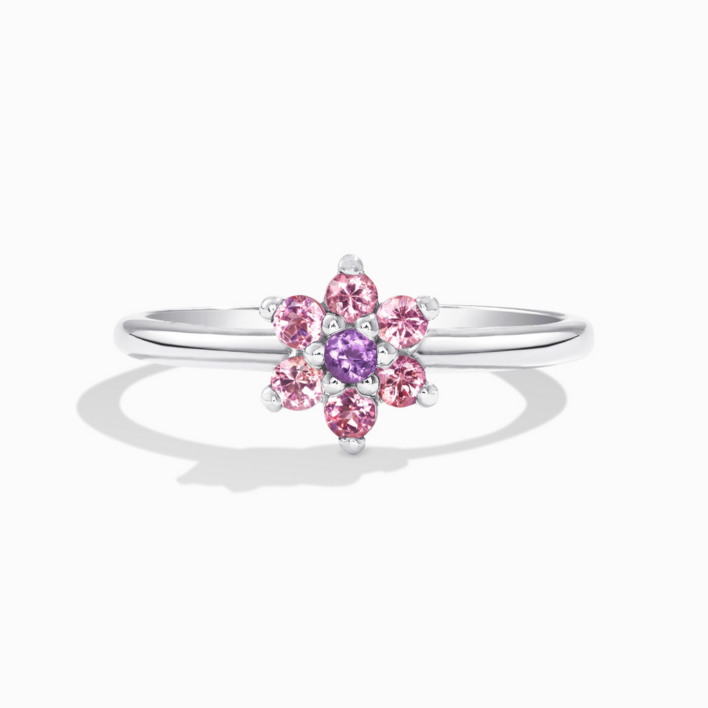 Pink tourmaline and amethyst flower ring in sterling silver on white background