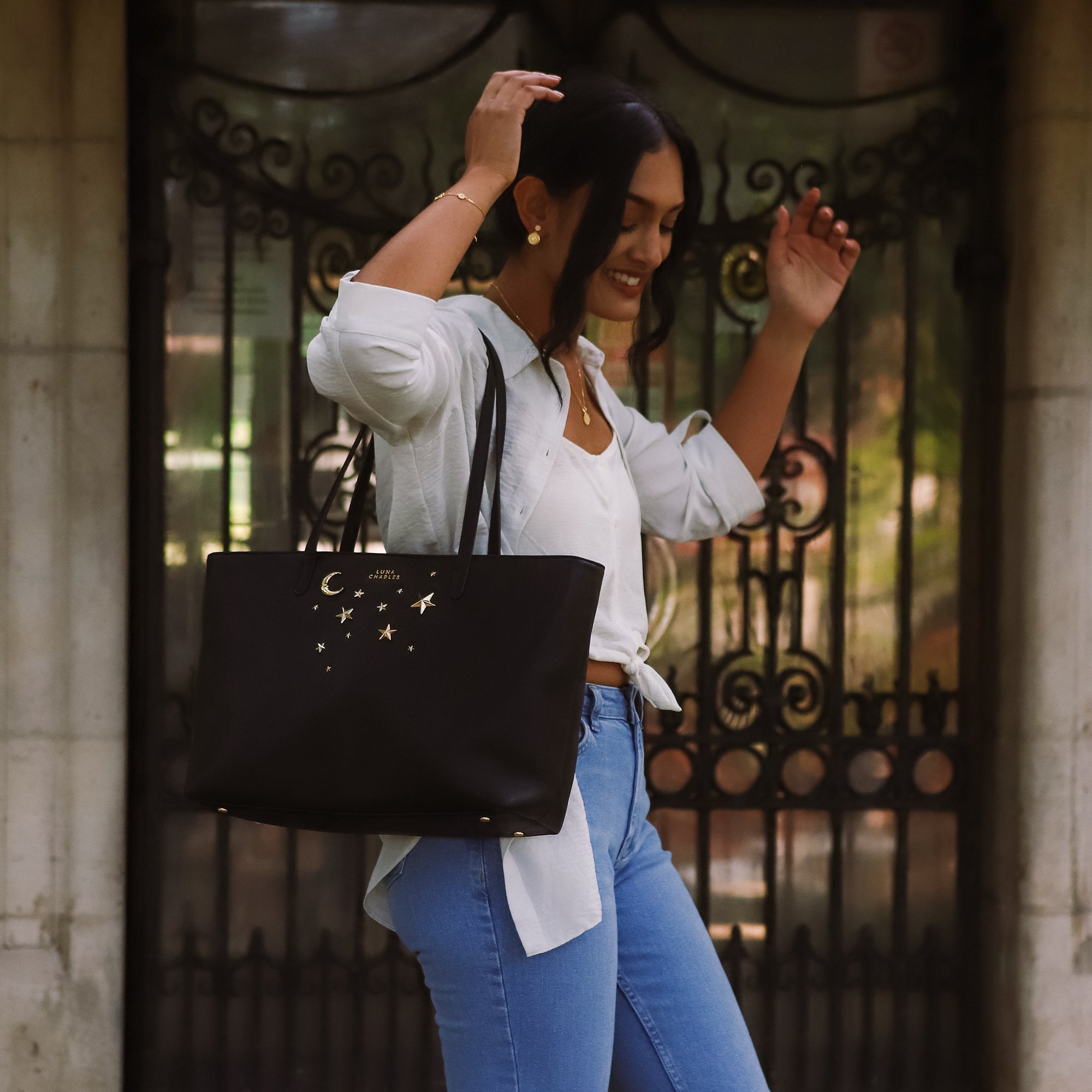 Luna Charles Anya black and gold star studded tote bag close-up