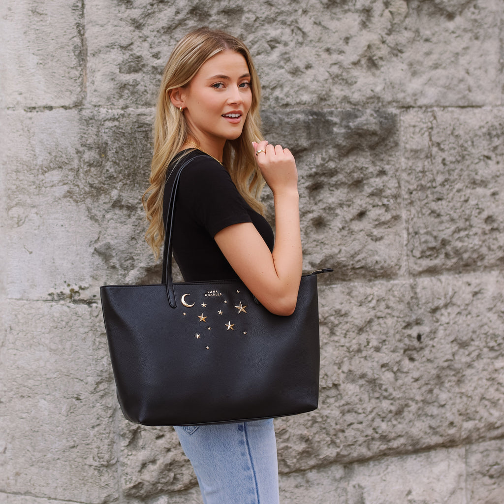 Luna Charles Anya black and gold tote bag styled with outfit