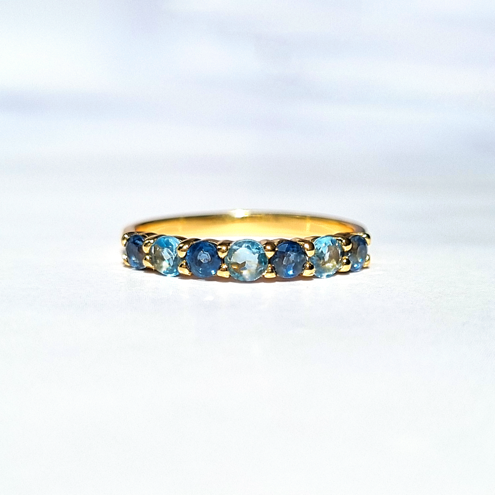 Blue sapphire and blue topaz half eternity band in 18k gold vermeil detail image