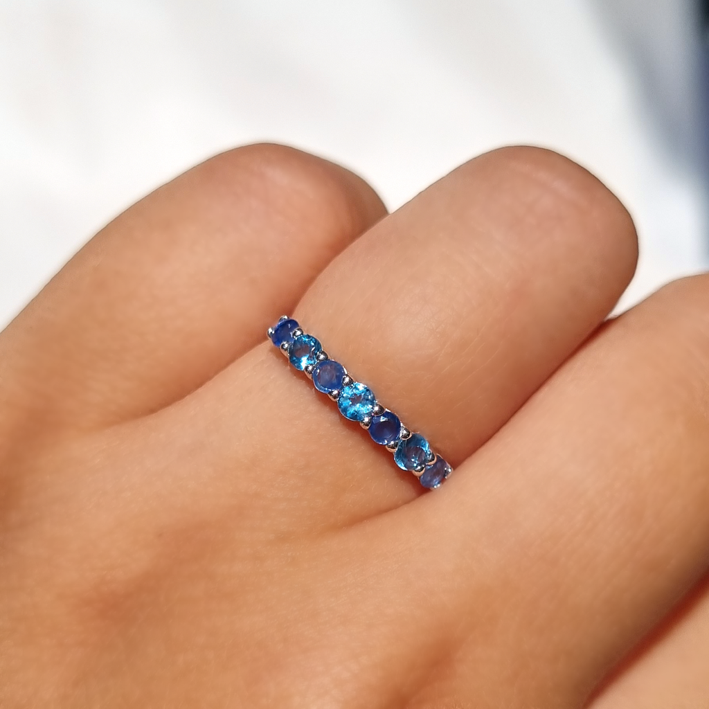 Blue sapphire and blue topaz ring in sterling silver on hand