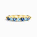 Blue sapphire and blue topaz half eternity band in 18k gold vermeil on white background