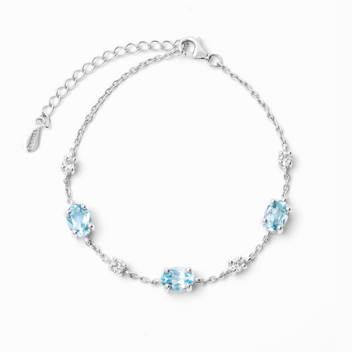 Blue topaz bracelet in sterling silver on white background