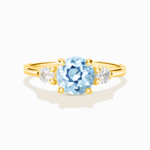 Blue topaz three stone ring in 18k gold vermeil on white background