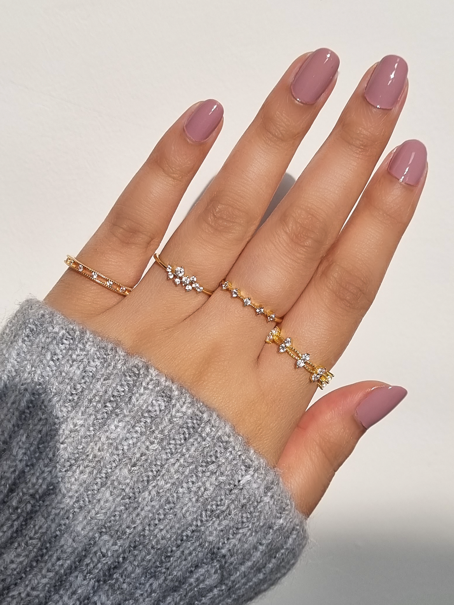 Dainty rings on hand including Stella Nova Celeste and Alana styles