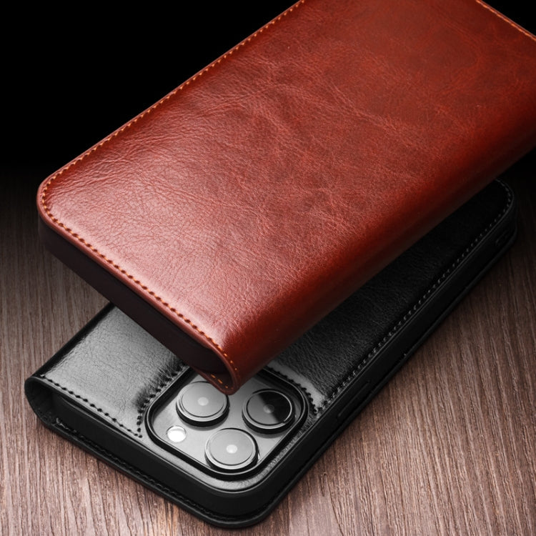 QIALINO Classic leather iPhone case detail showing button and port access