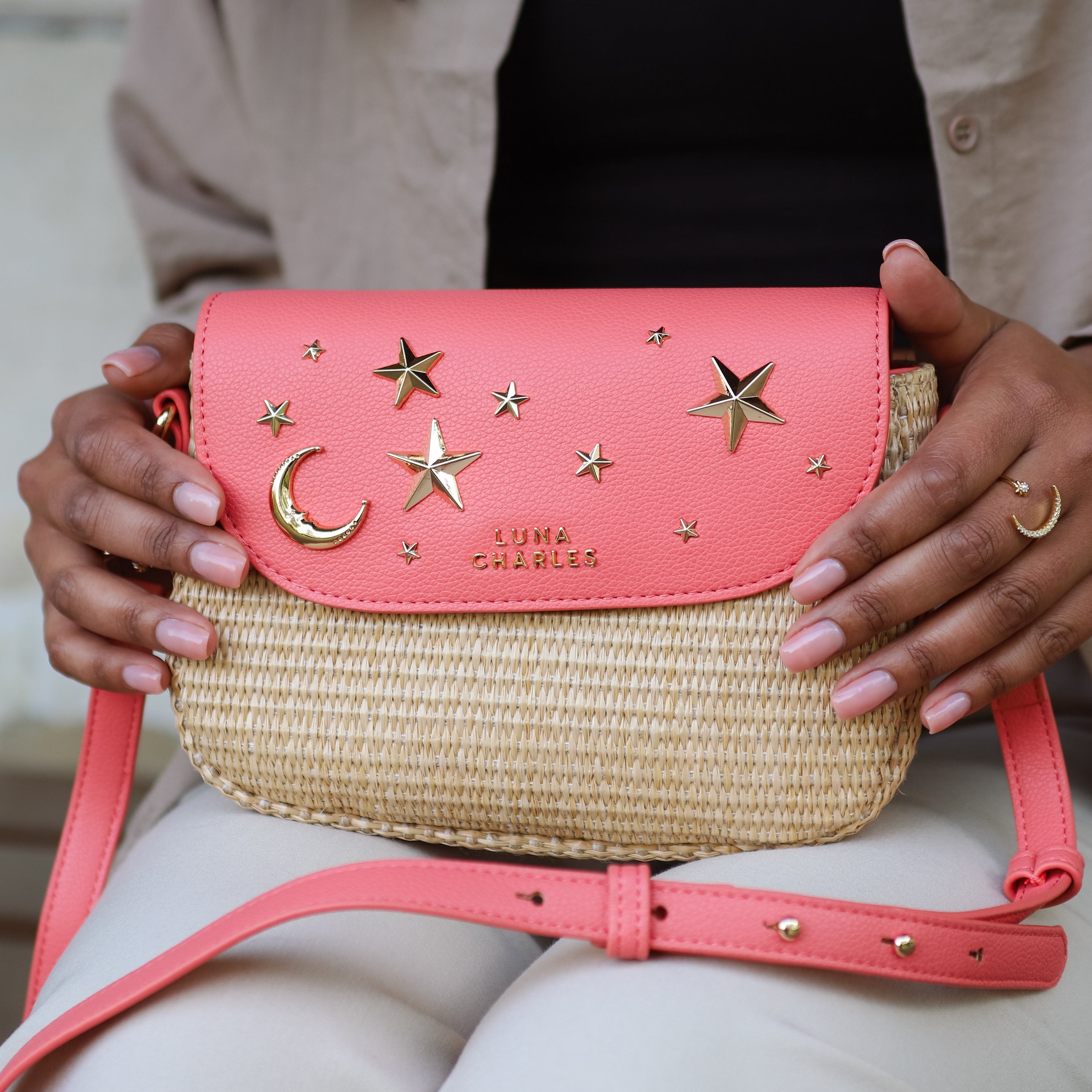 Luna Charles Elena coral and gold rattan handbag lifestyle image