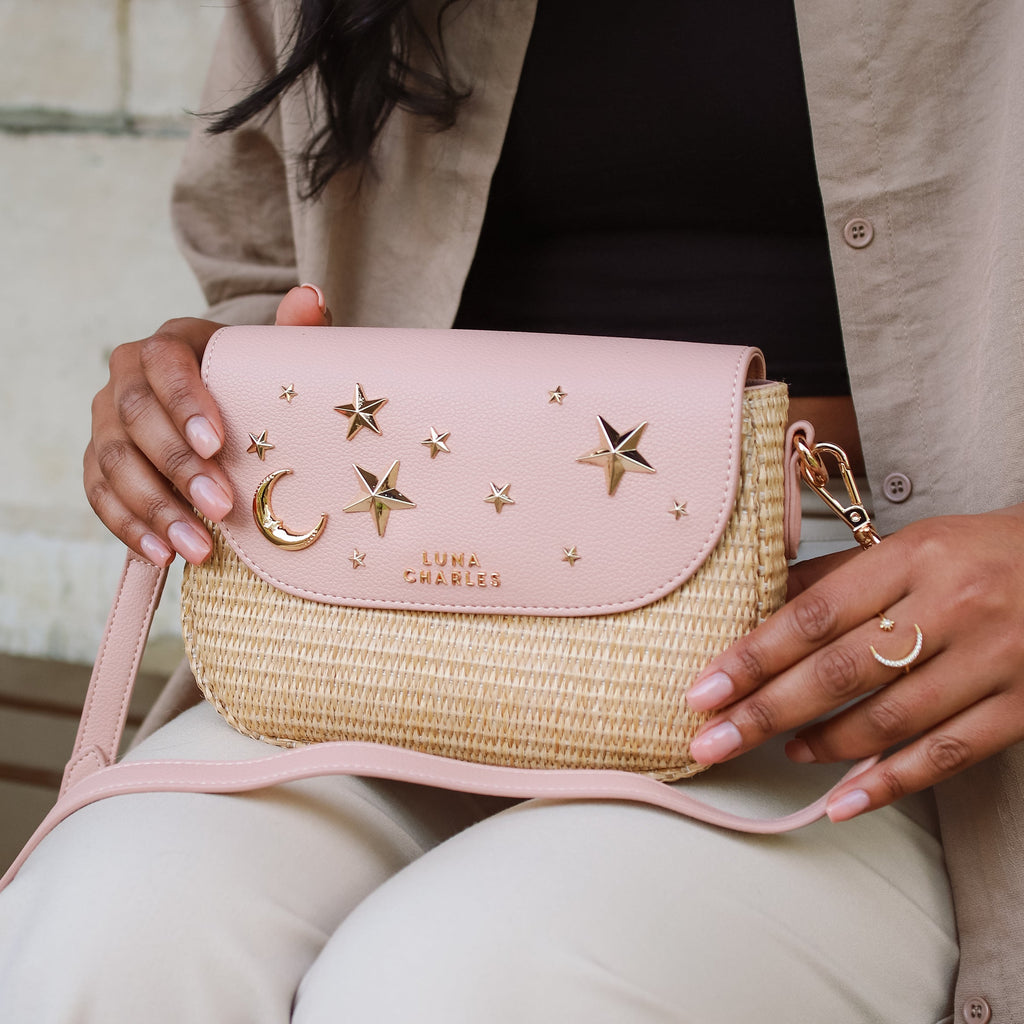 Luna Charles Elena pink and gold rattan handbag styled with pearl accessories