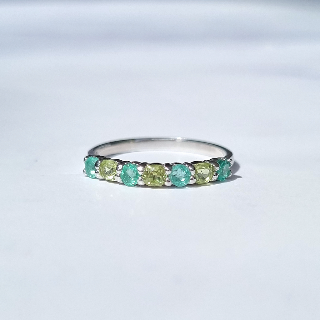 Emerald and peridot half eternity band in sterling silver detail image