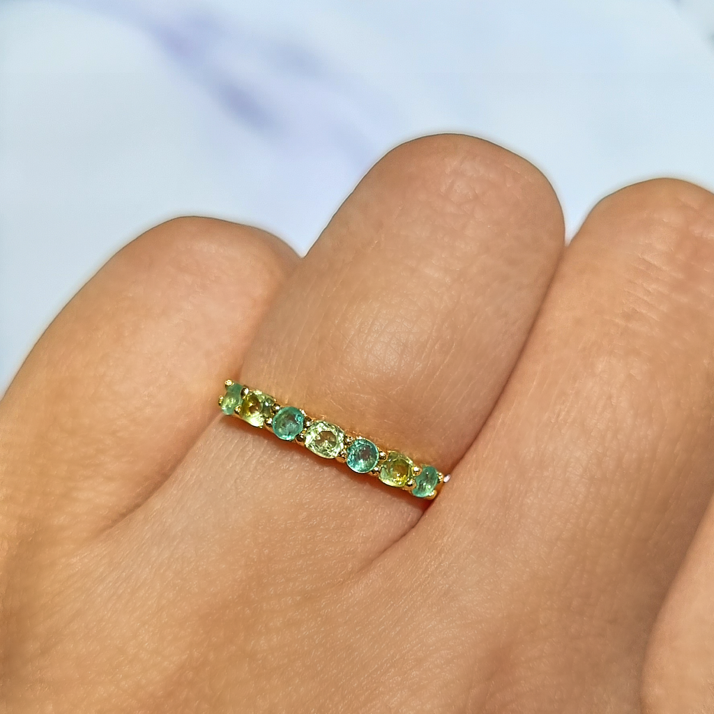 Emerald and peridot half eternity ring in 18k gold vermeil on hand