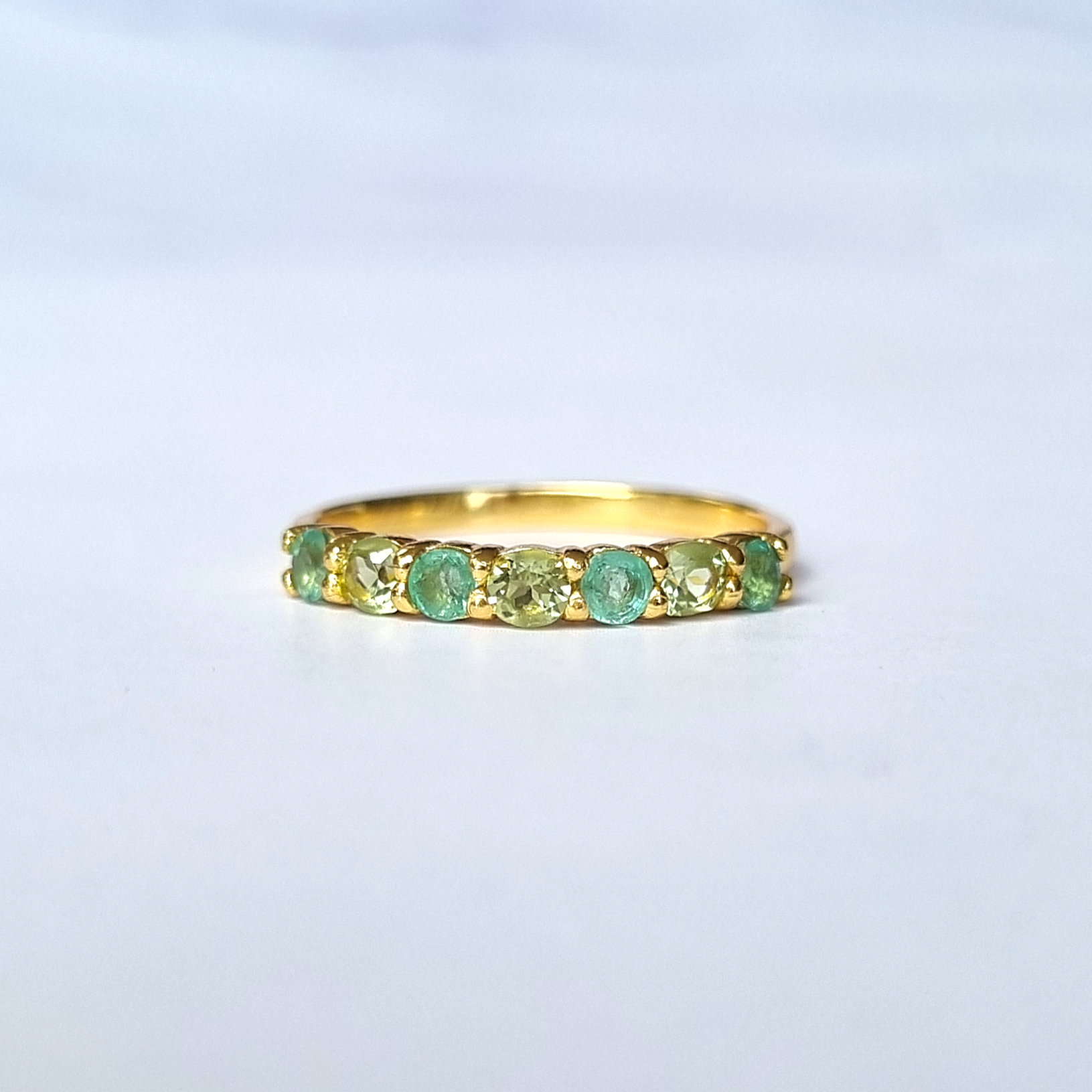 Emerald and peridot half eternity ring in 18k gold vermeil detail image