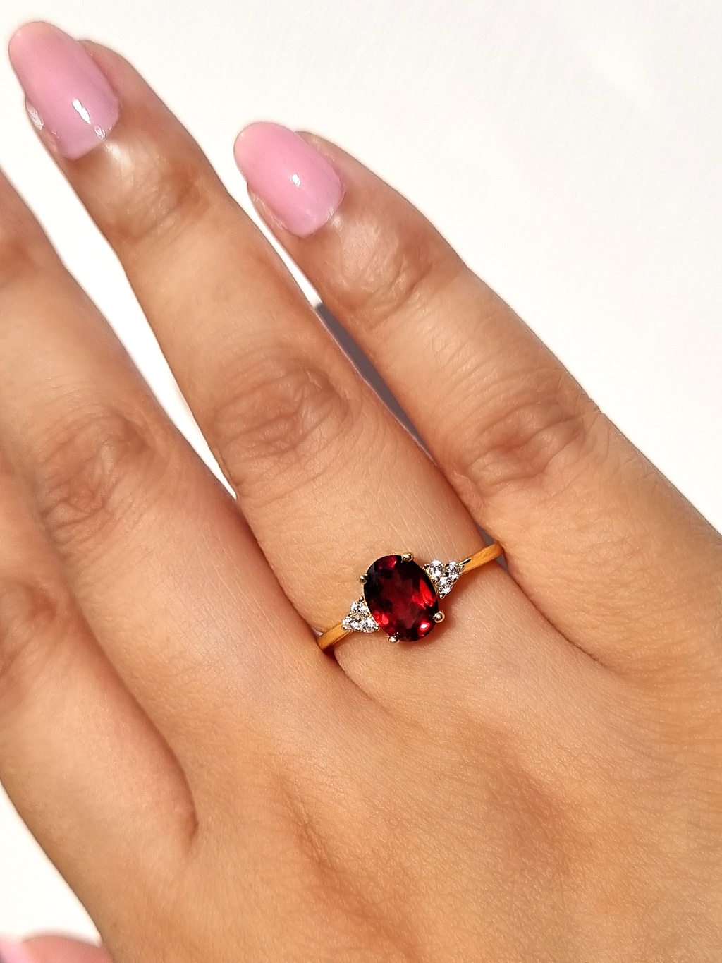 Garnet ring in 18k gold vermeil hand detail image