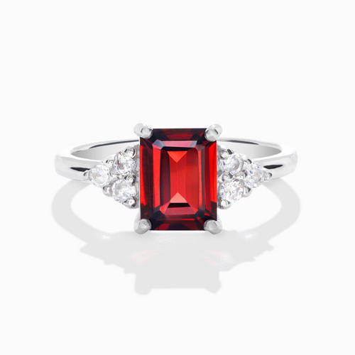 Garnet emerald cut ring in sterling silver on white background