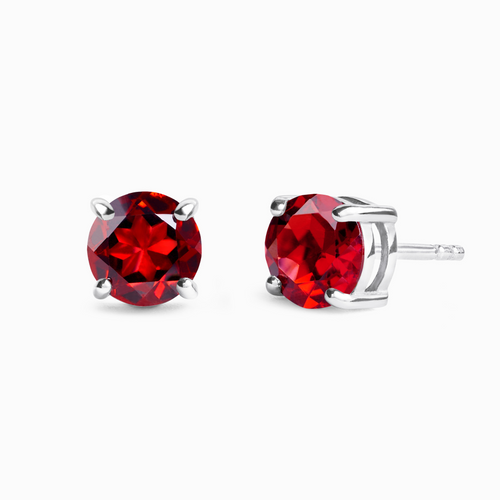 Garnet round stud earrings in sterling silver on white background