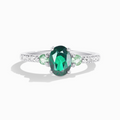 Green topaz and green tourmaline ring in sterling silver on white background