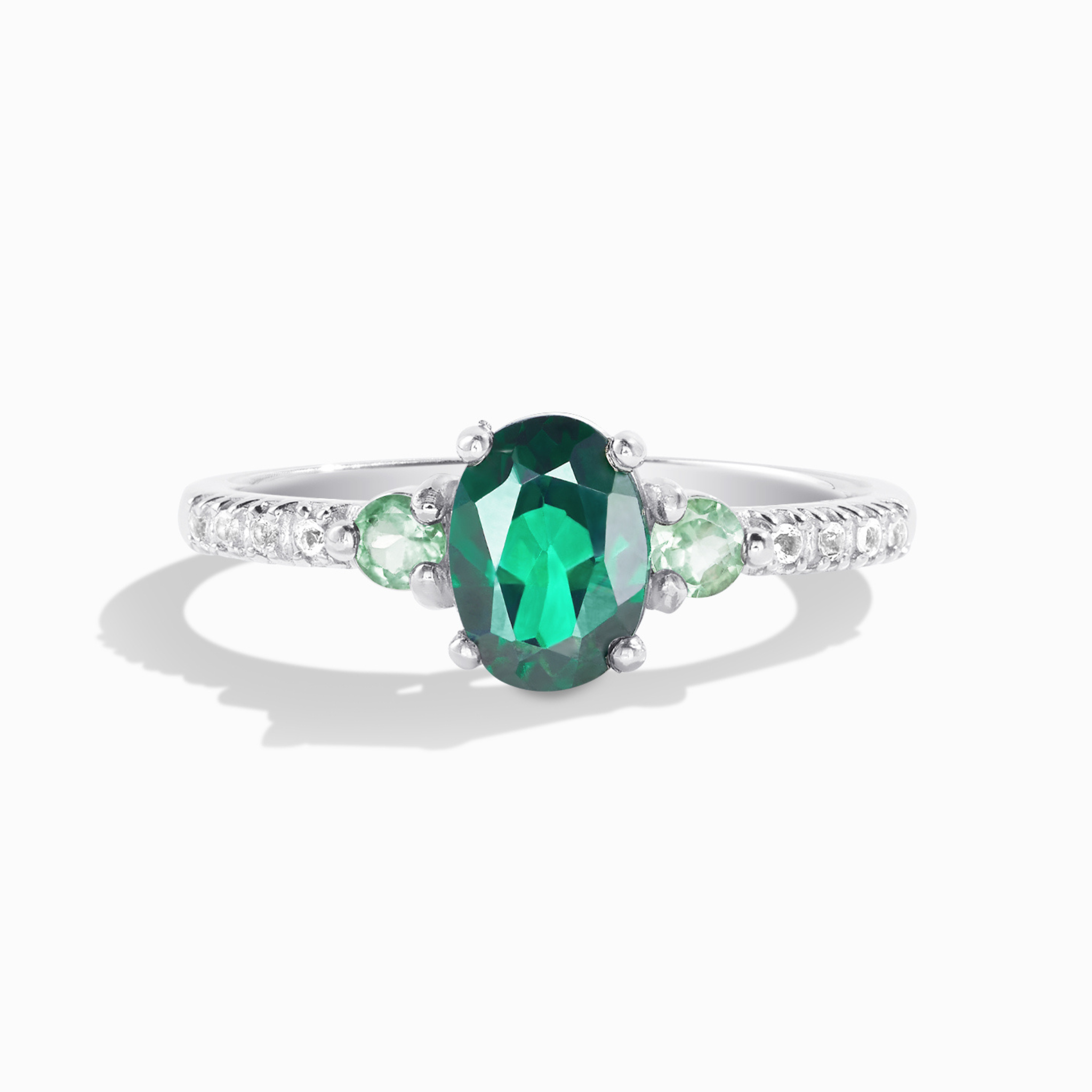 Green topaz and green tourmaline ring in sterling silver on white background