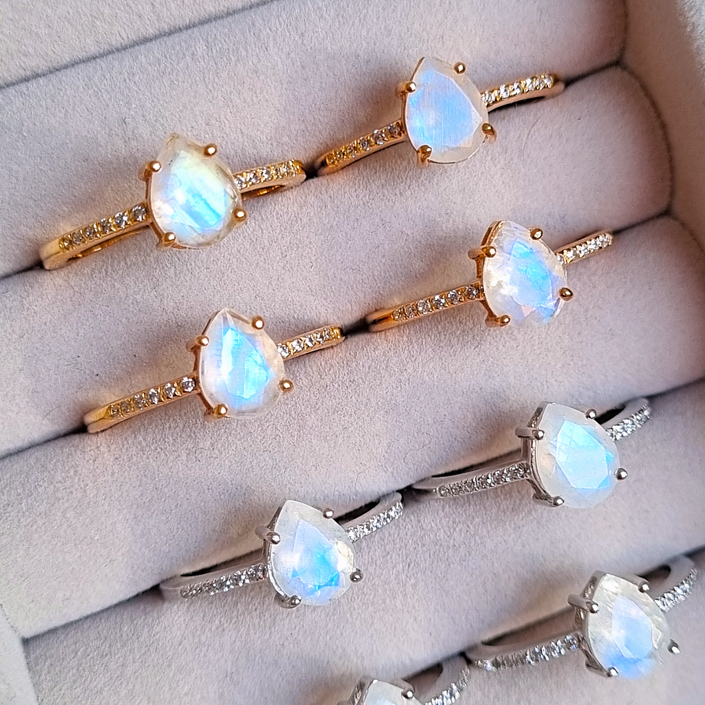 Pear cut rainbow moonstone rings group image