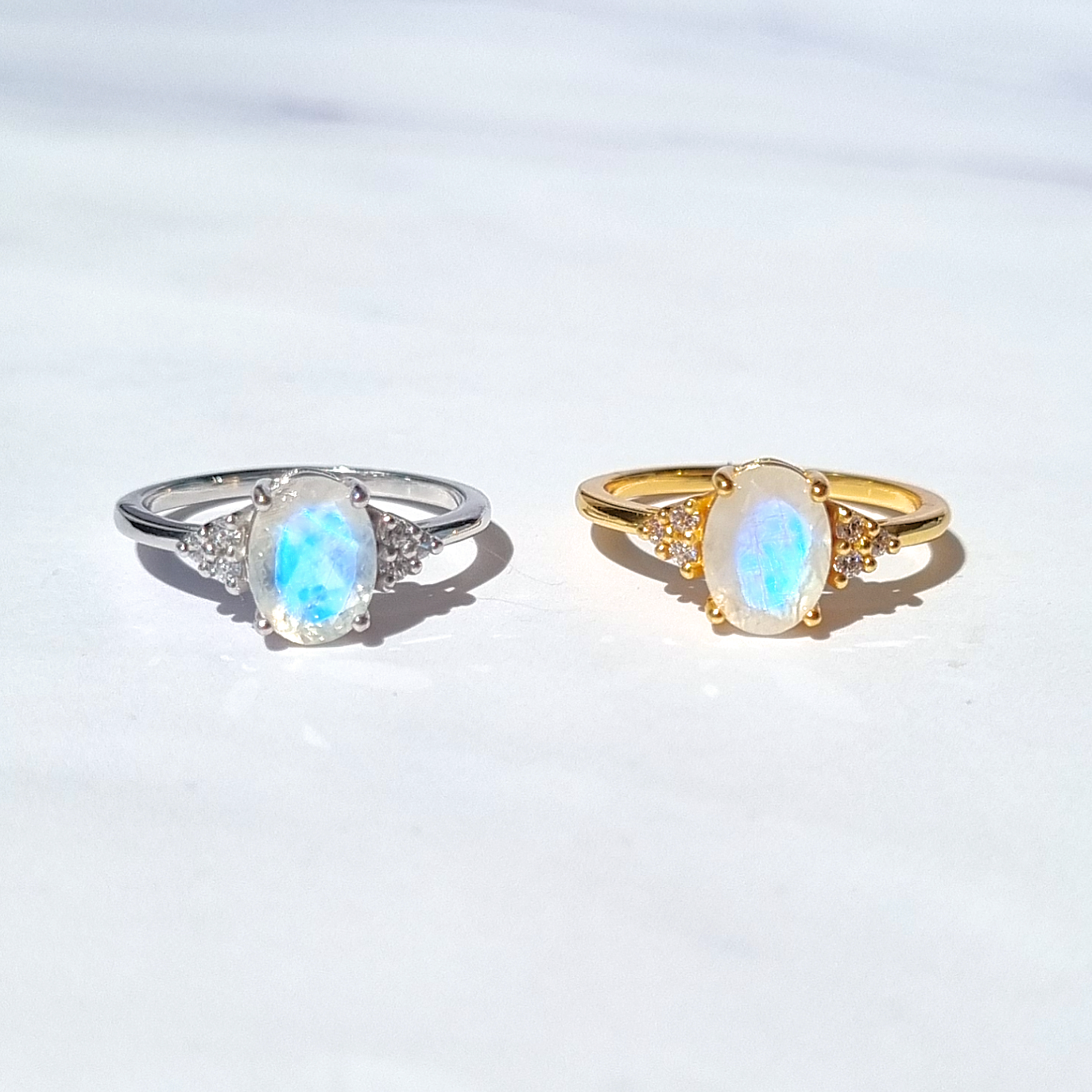 Rainbow moonstone oval cut rings in 18k gold vermeil and sterling silver group image