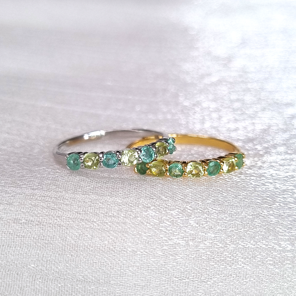 Emerald and peridot half eternity rings group product image