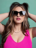 zoedepass Lily Forest Green cat-eye sunglasses close-up on model