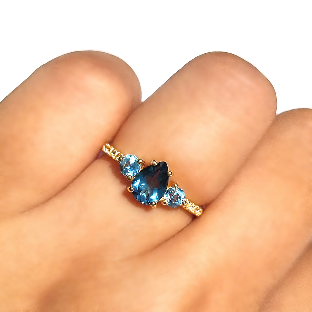 London blue and Swiss blue topaz pear cut ring in 18k gold vermeil on hand