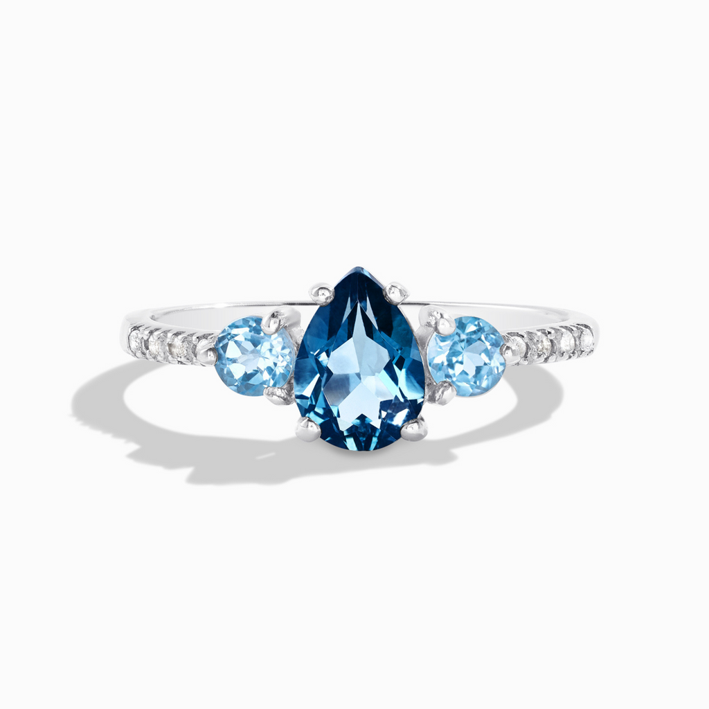 London and Swiss blue topaz ring in sterling silver on white background