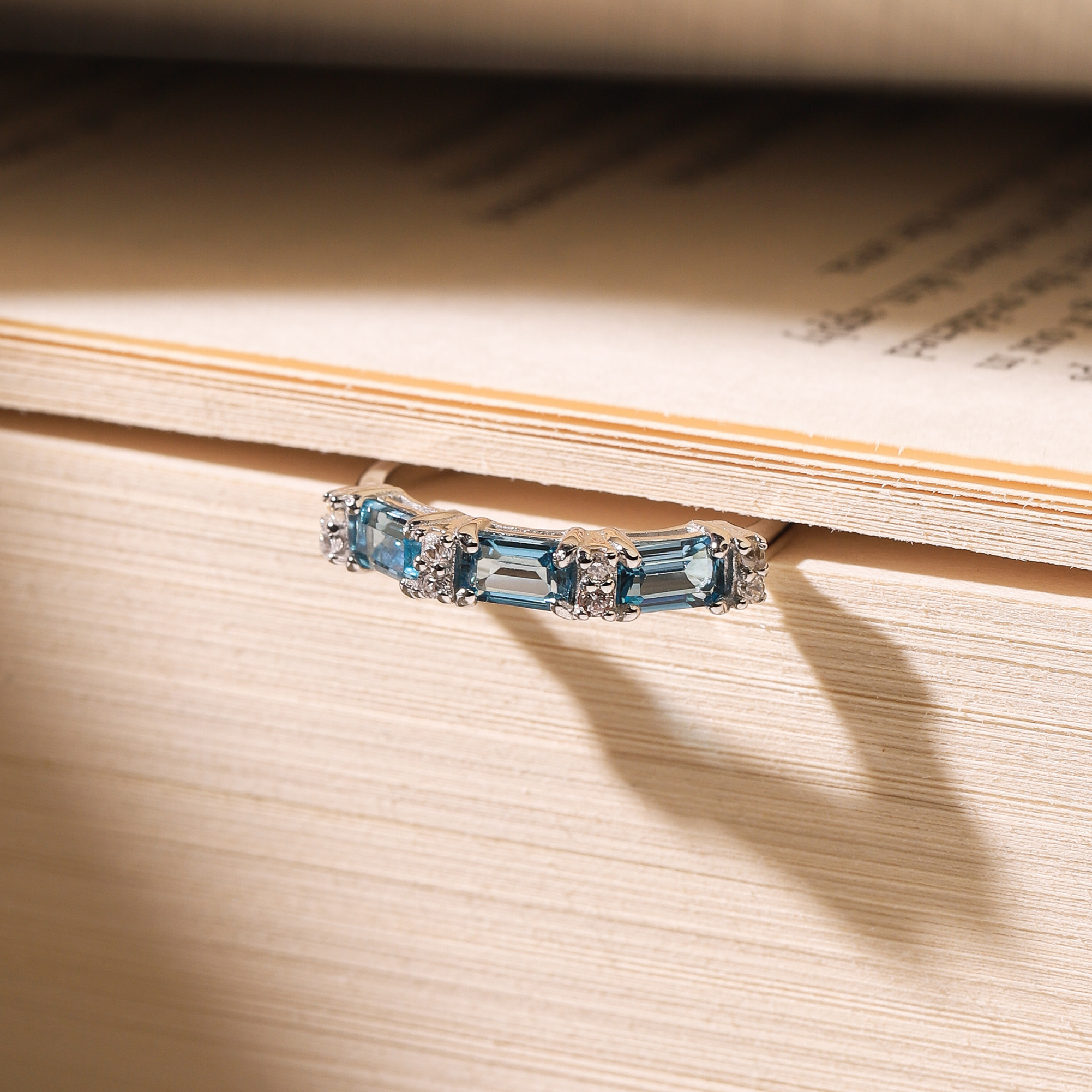 London blue topaz emerald cut eternity rings in sterling silver lifestyle image