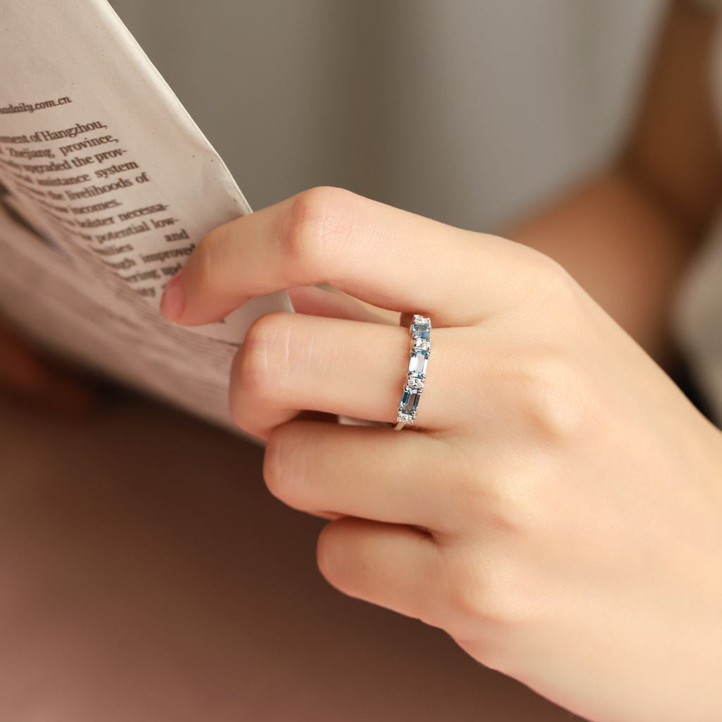 London blue topaz emerald cut eternity rings in sterling silver styled image