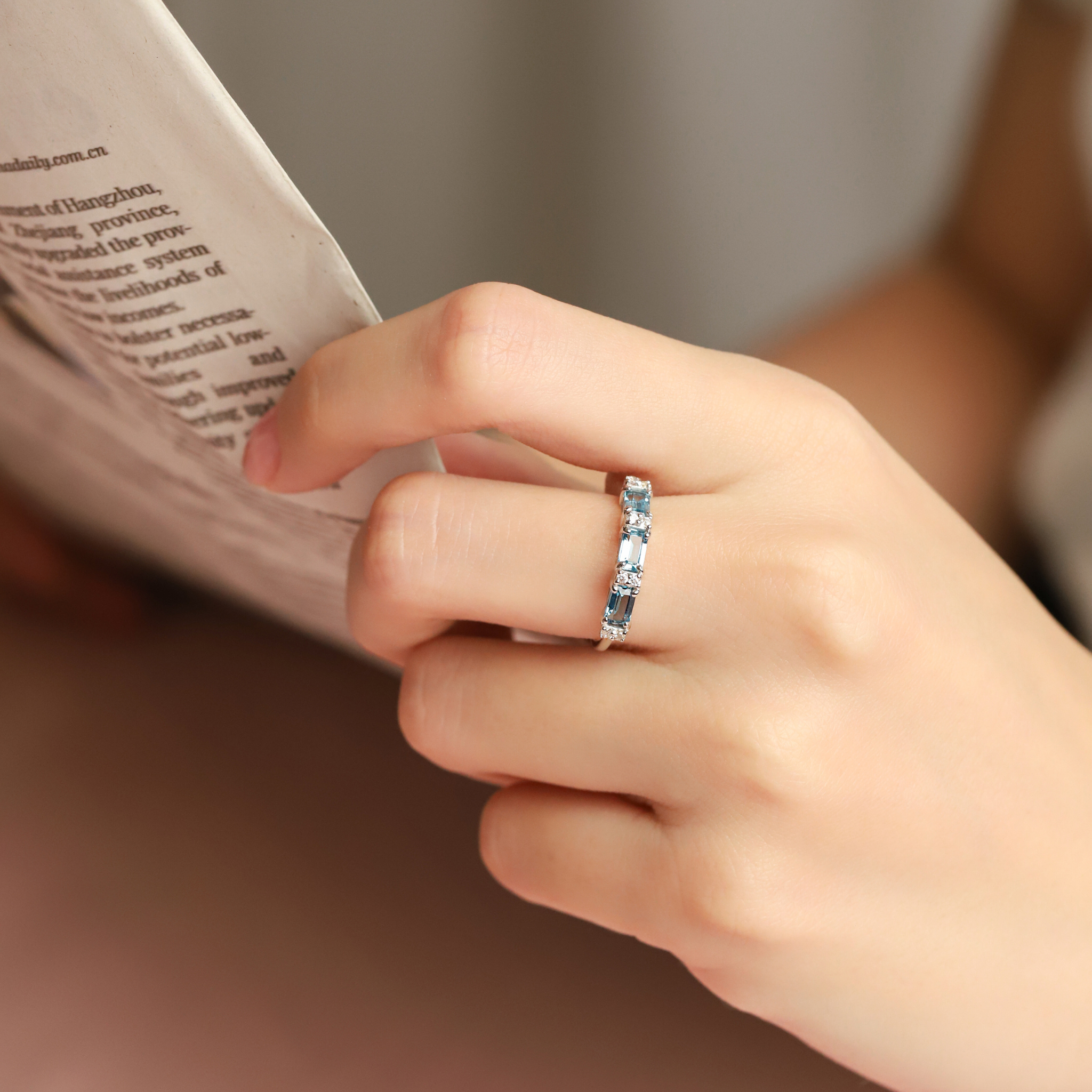 London blue topaz emerald cut eternity rings in sterling silver styled image