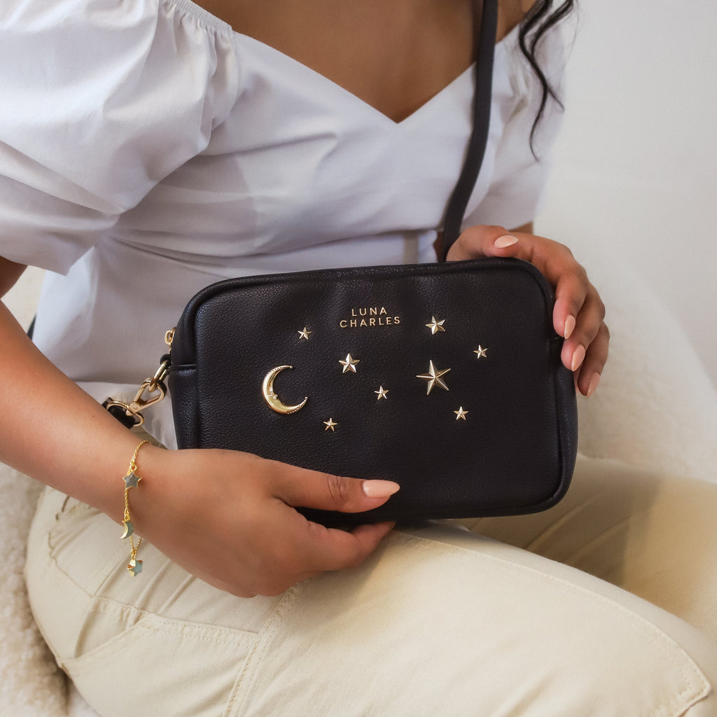 Luna Charles Maya black and gold crossbody bag on model