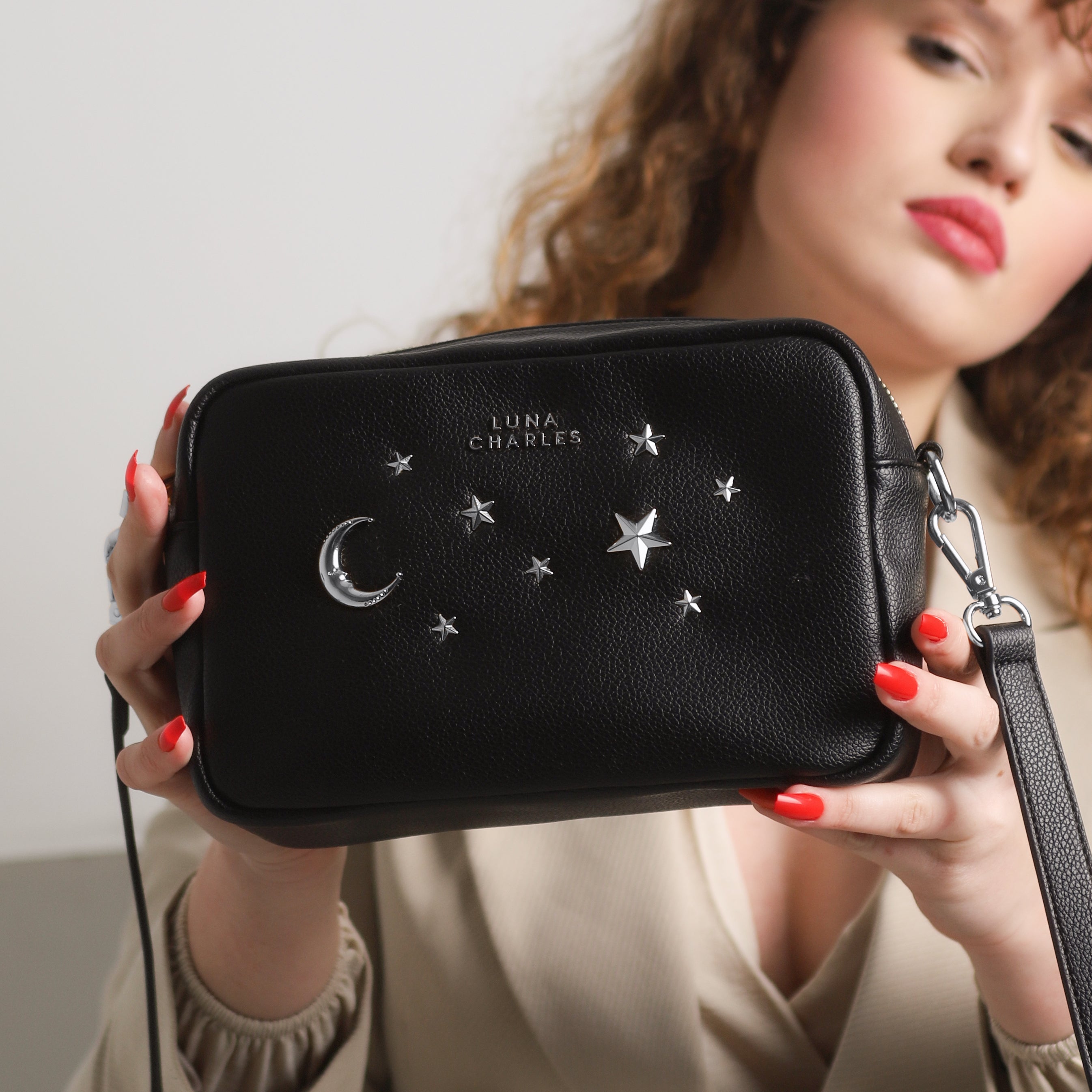 Luna Charles Maya black and silver crossbody bag styled detail image