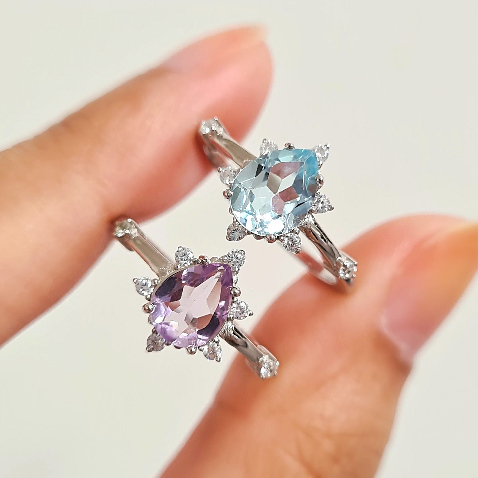 Sky blue topaz and lavender amethyst rings group image