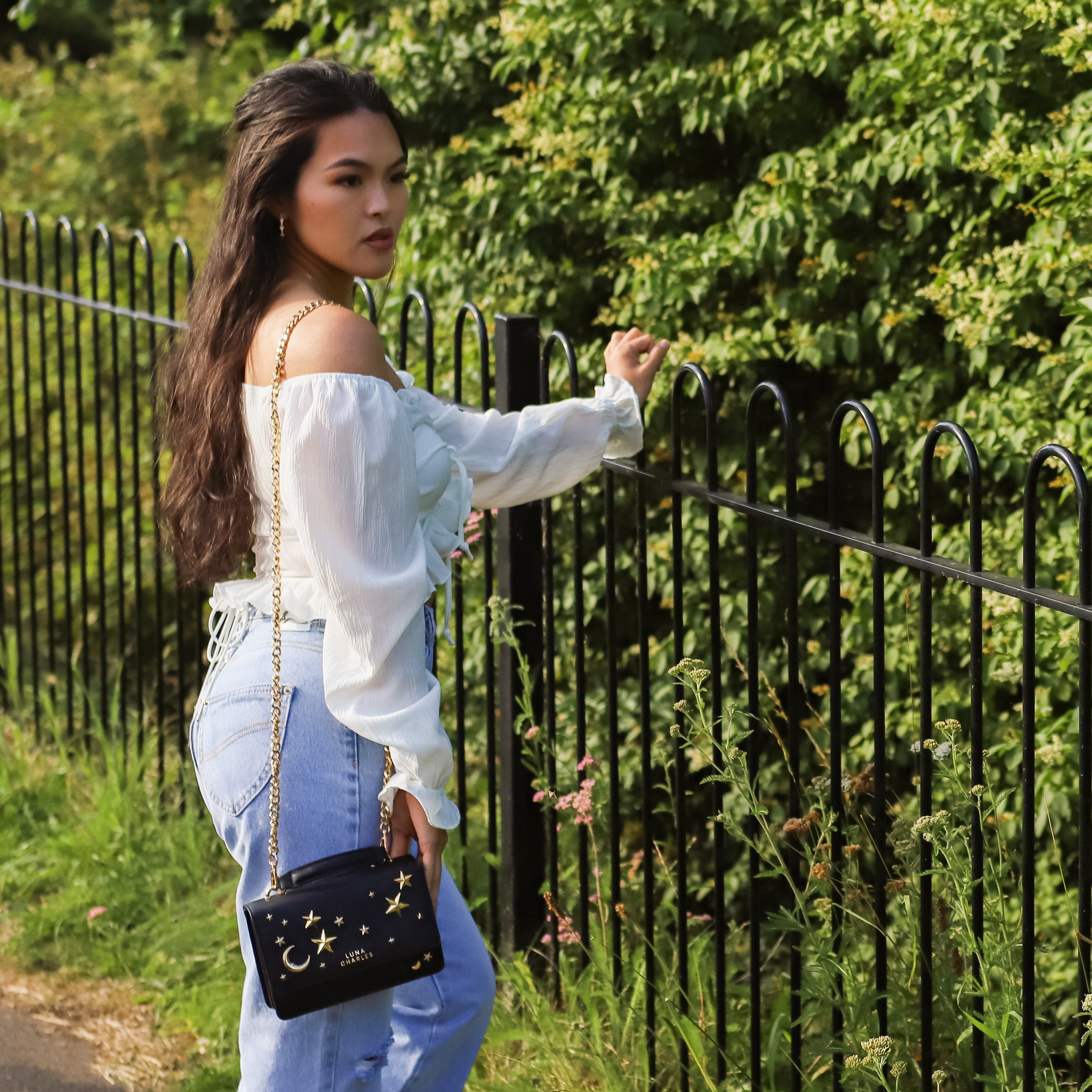 Luna Charles Nova black and gold star studded bag front detail