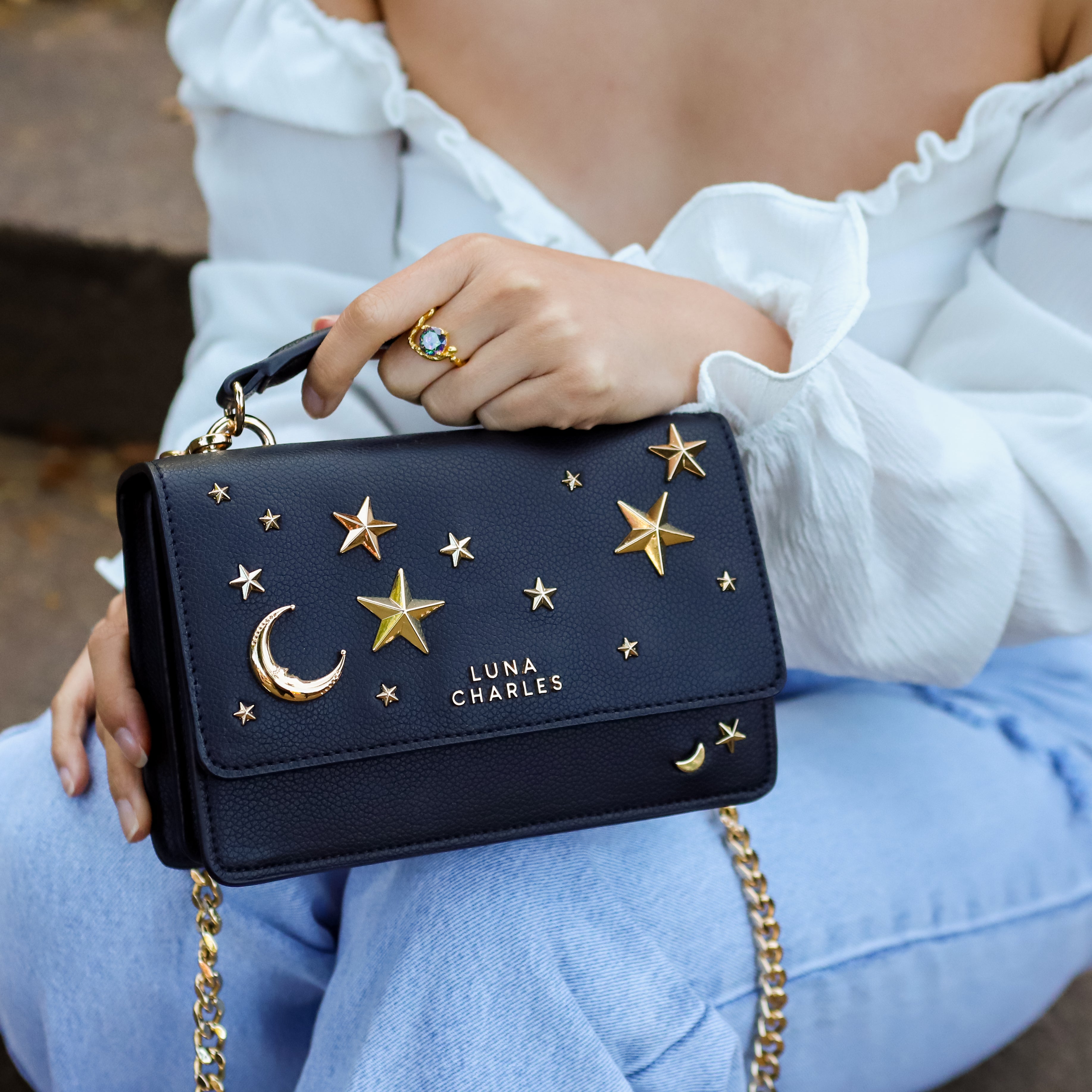 Luna Charles Nova black and gold crossbody bag on model