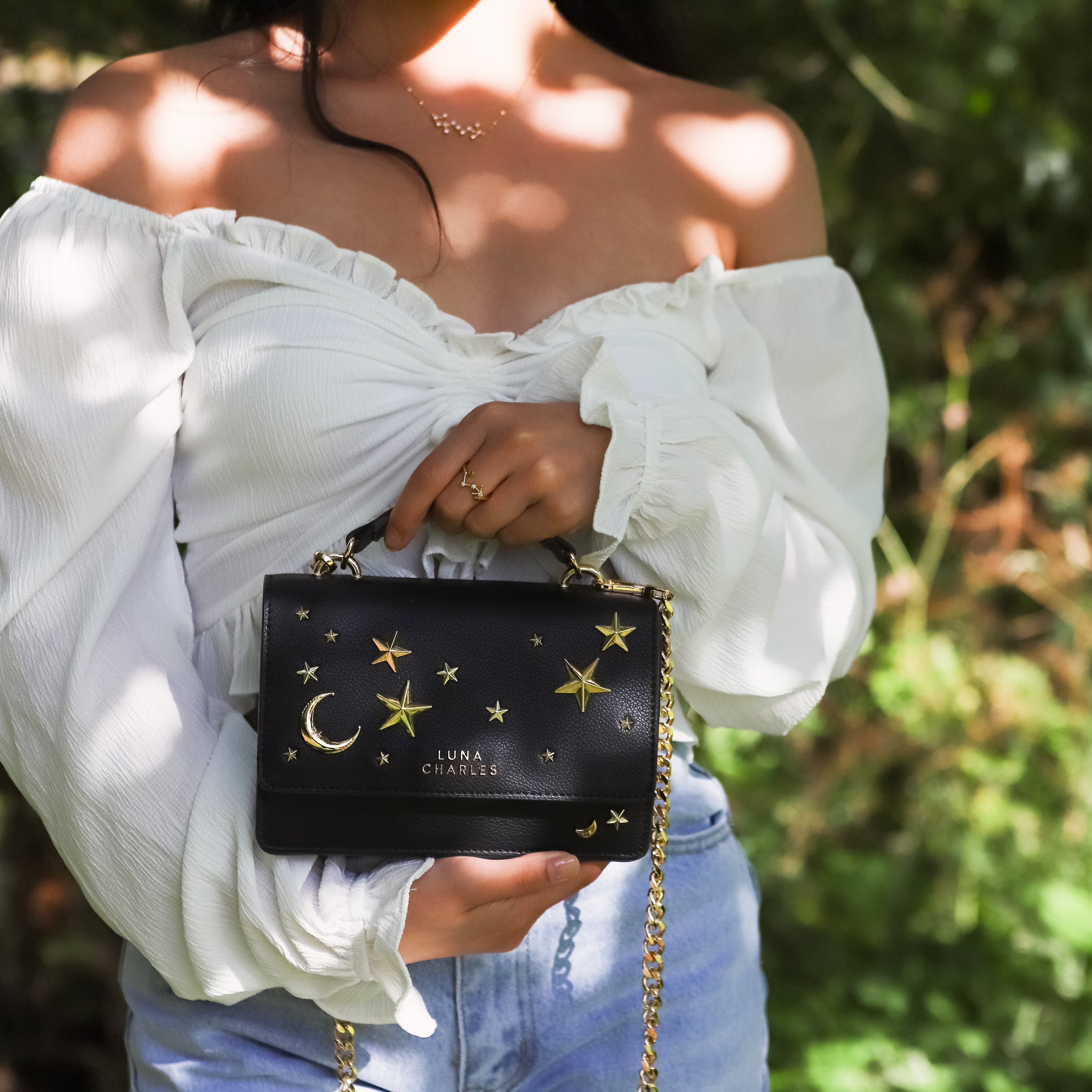 Luna Charles Nova black and gold crossbody bag product detail image