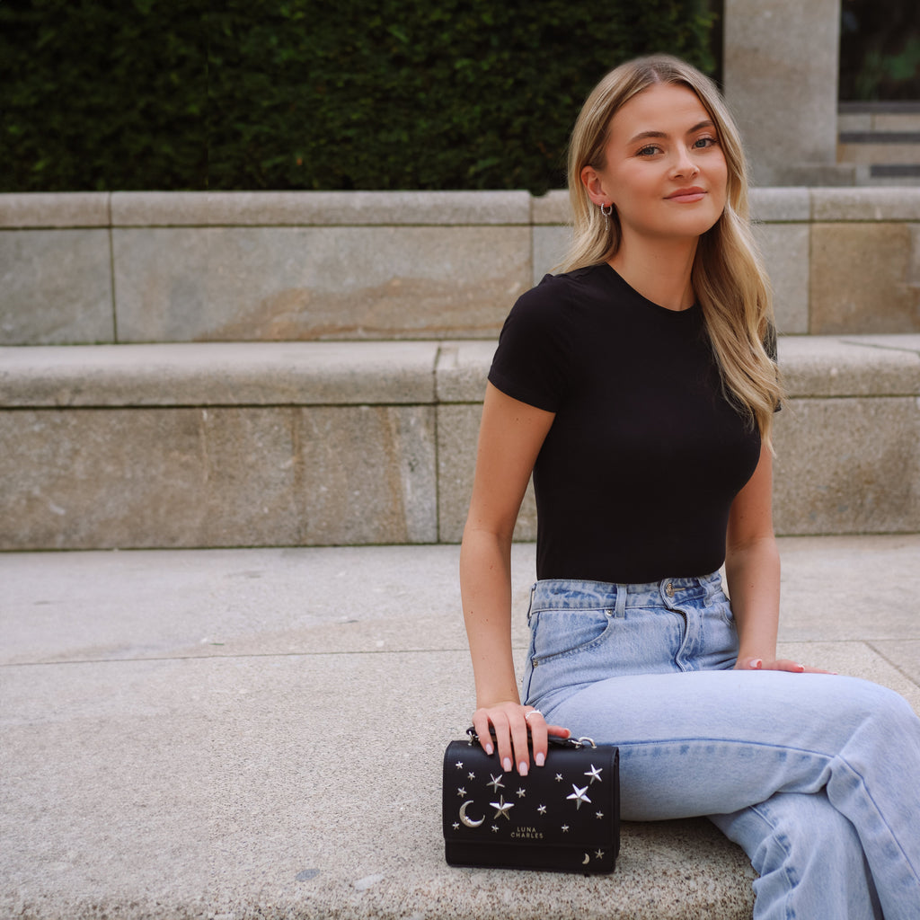 Luna Charles Nova black and silver crossbody bag styled on model