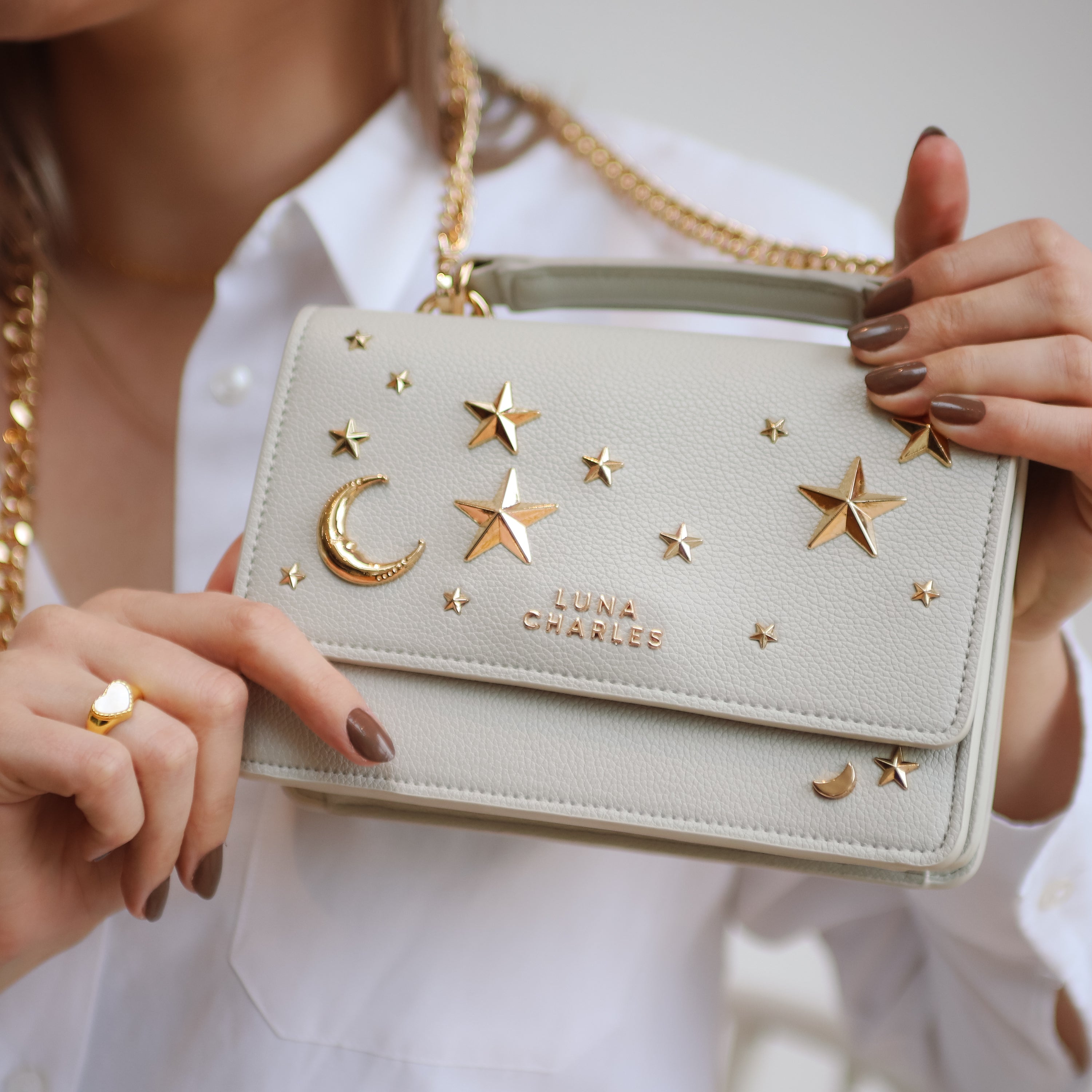 Luna Charles Nova grey and gold crossbody bag close-up detail