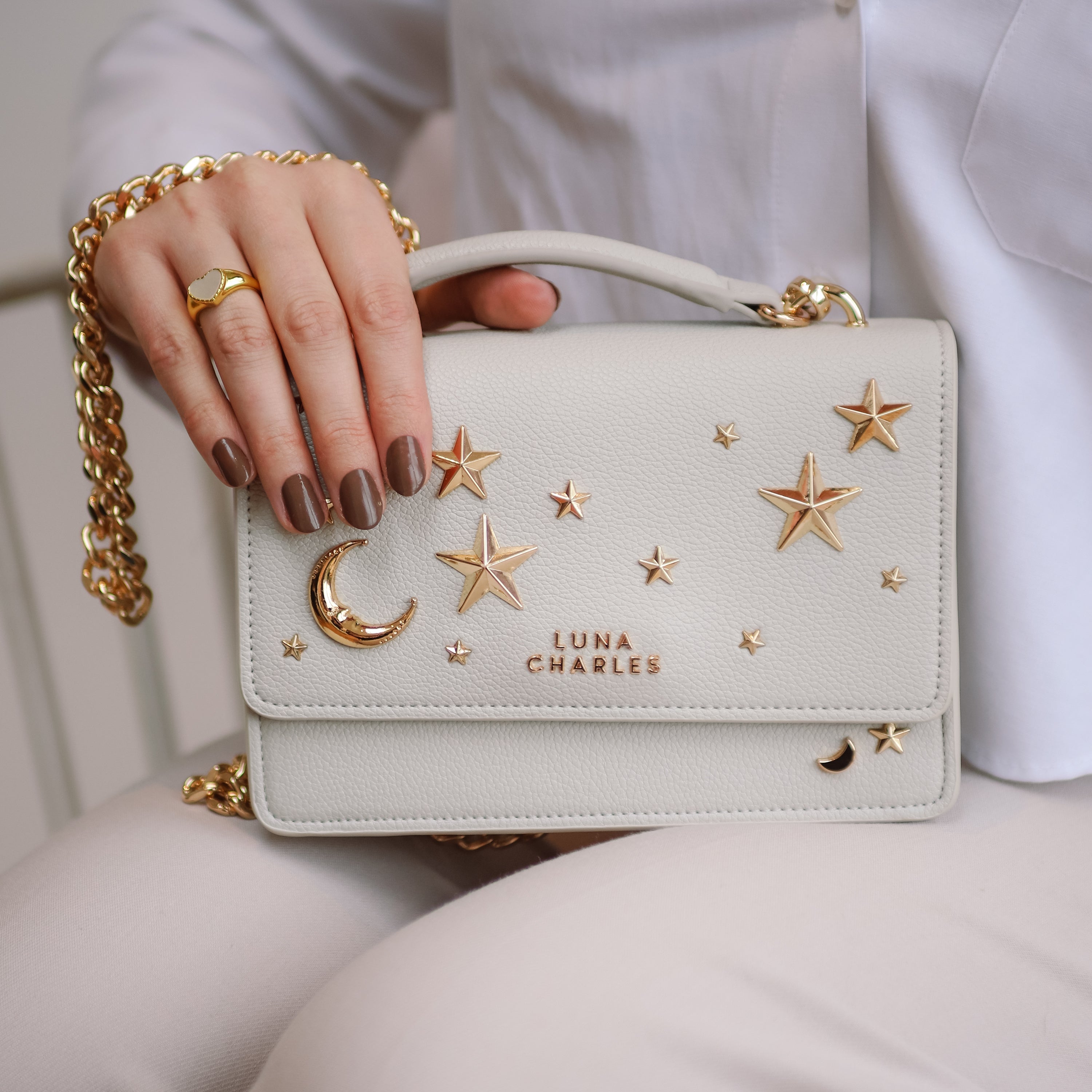 Luna Charles Nova grey and gold crossbody bag lifestyle detail image