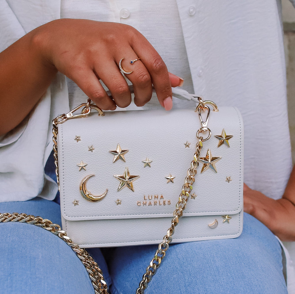 Luna Charles Nova grey and gold crossbody bag styled on model