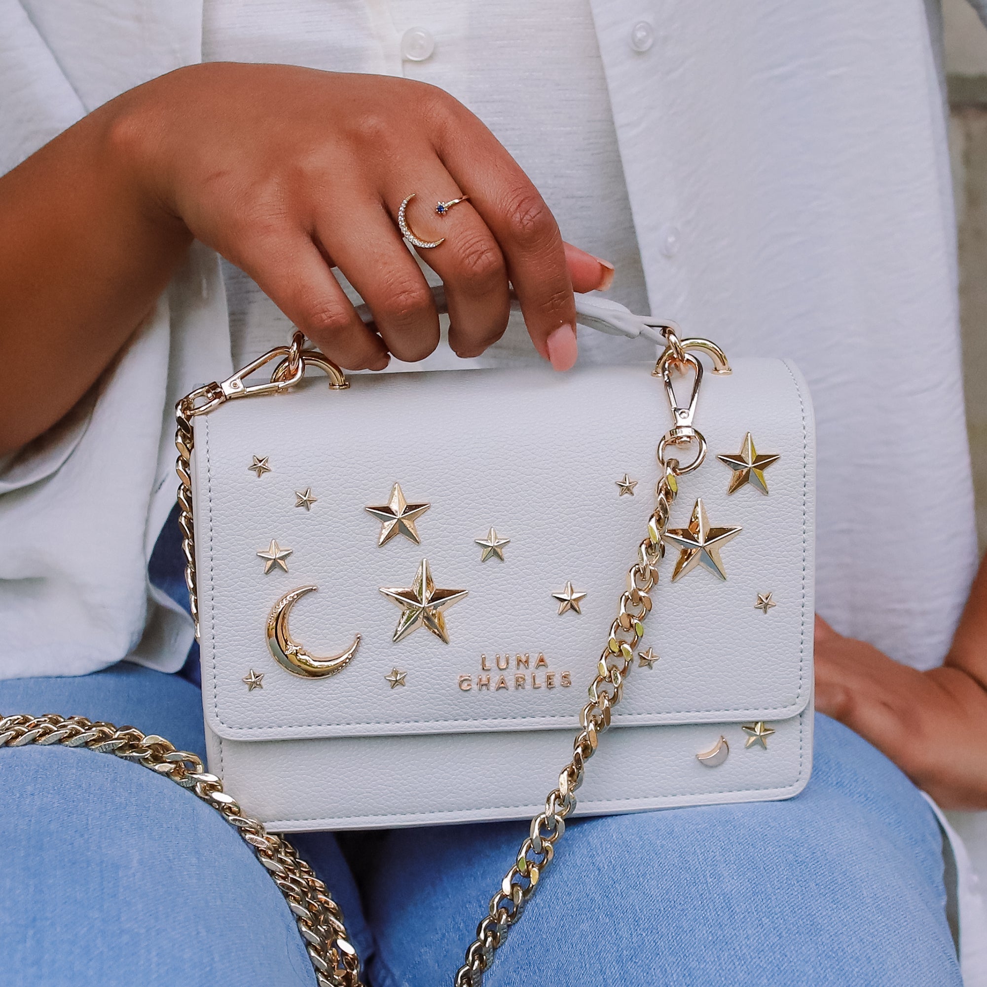 Luna Charles Nova grey and gold crossbody bag styled on model