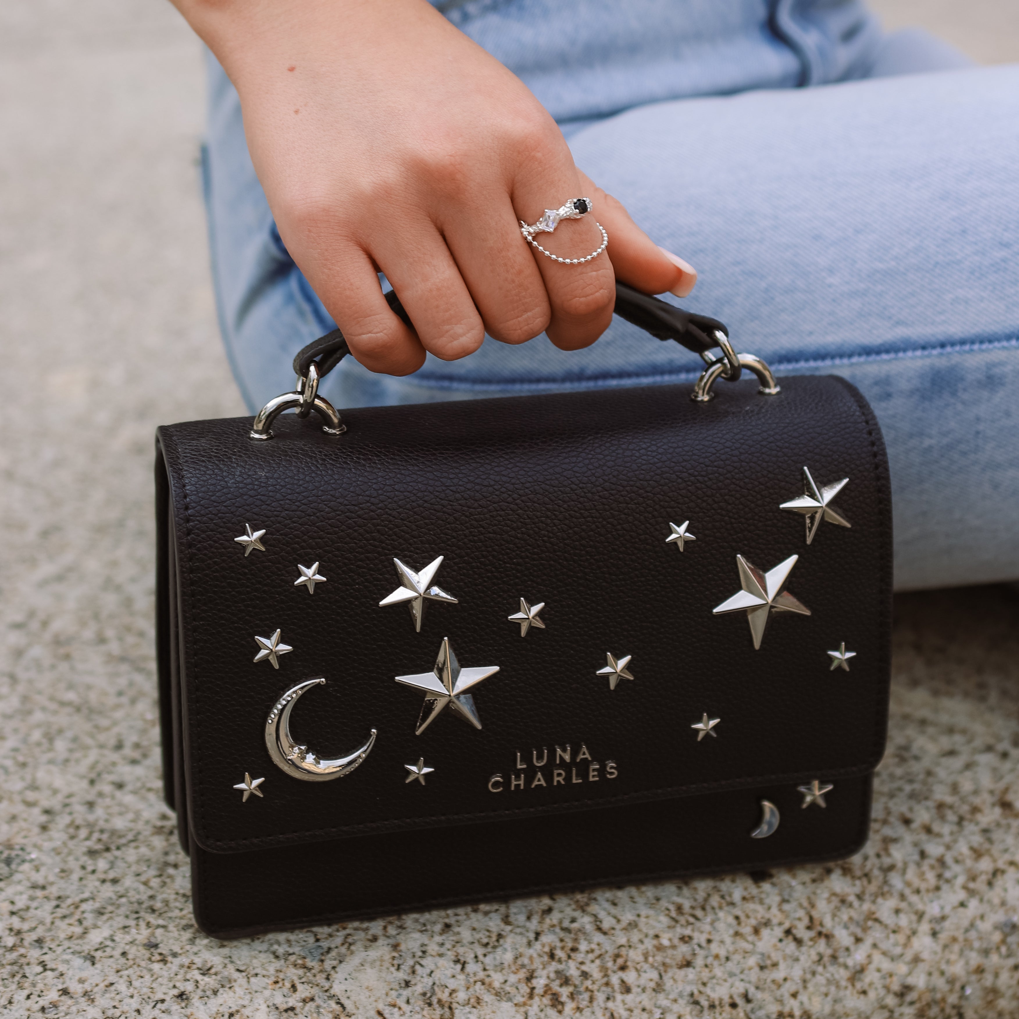 Luna Charles Nova black and silver crossbody bag lifestyle model image