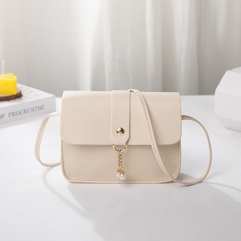 Kenike beige white contrast pearl pendant small square bag variant