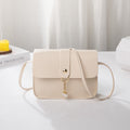 Kenike beige white contrast pearl pendant small square bag variant