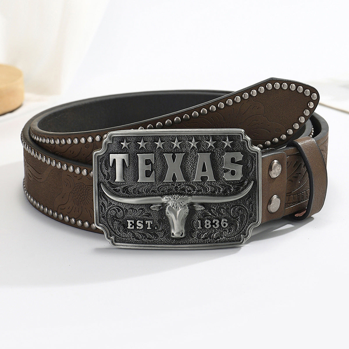 Kenike western cow head buckle denim belt in brown front view