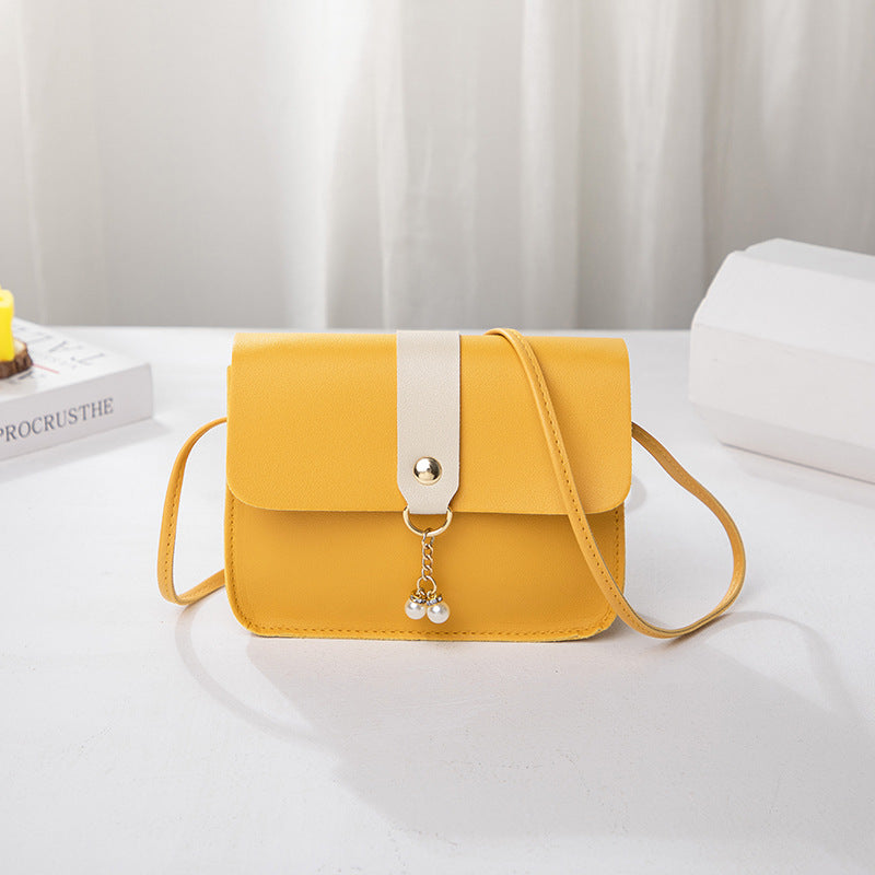 Kenike yellow contrast pearl pendant small square bag variant