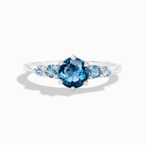 Ombre blue topaz five stone ring in sterling silver on white background