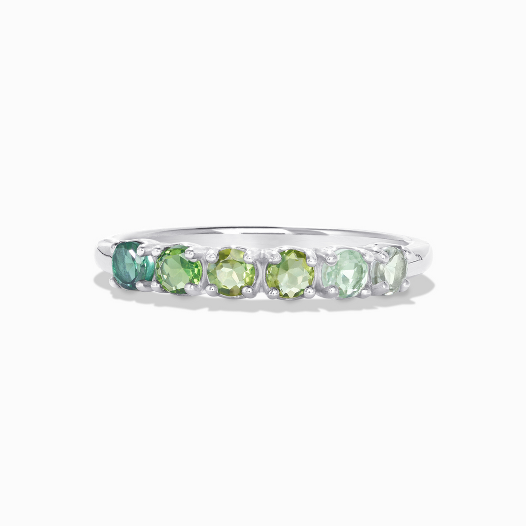 Ombre green tourmaline eternity band in sterling silver on white background